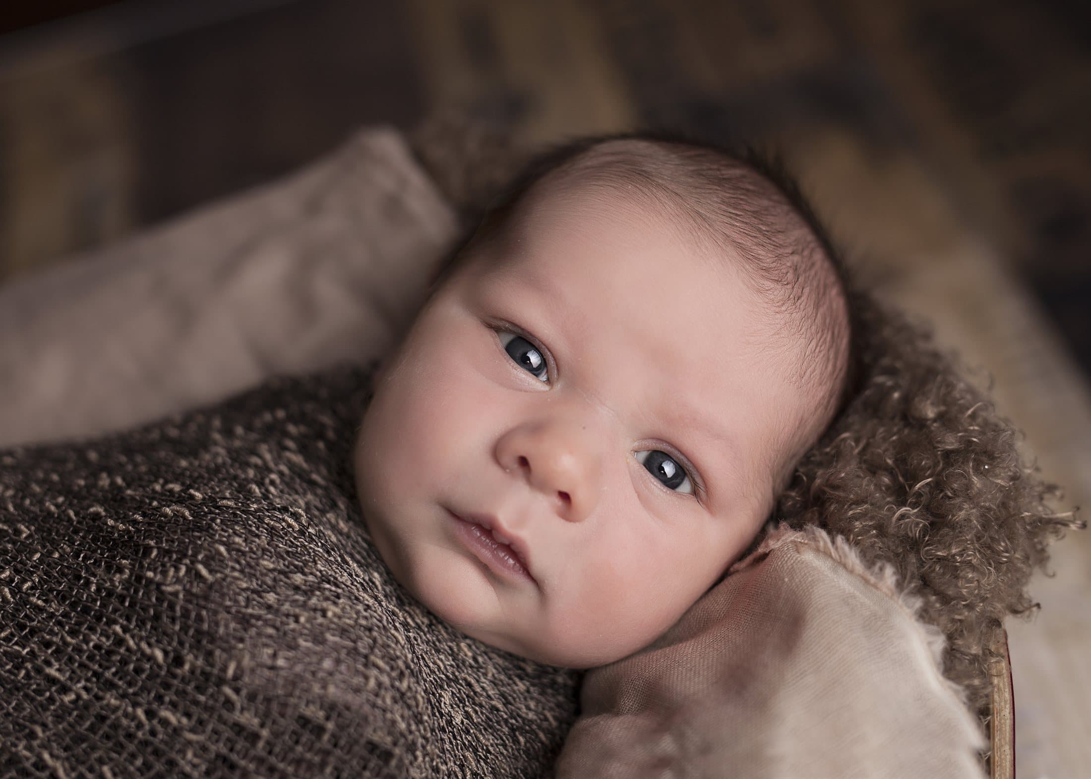 Close newborn portrait ready to become a personal wooden puzzle gift