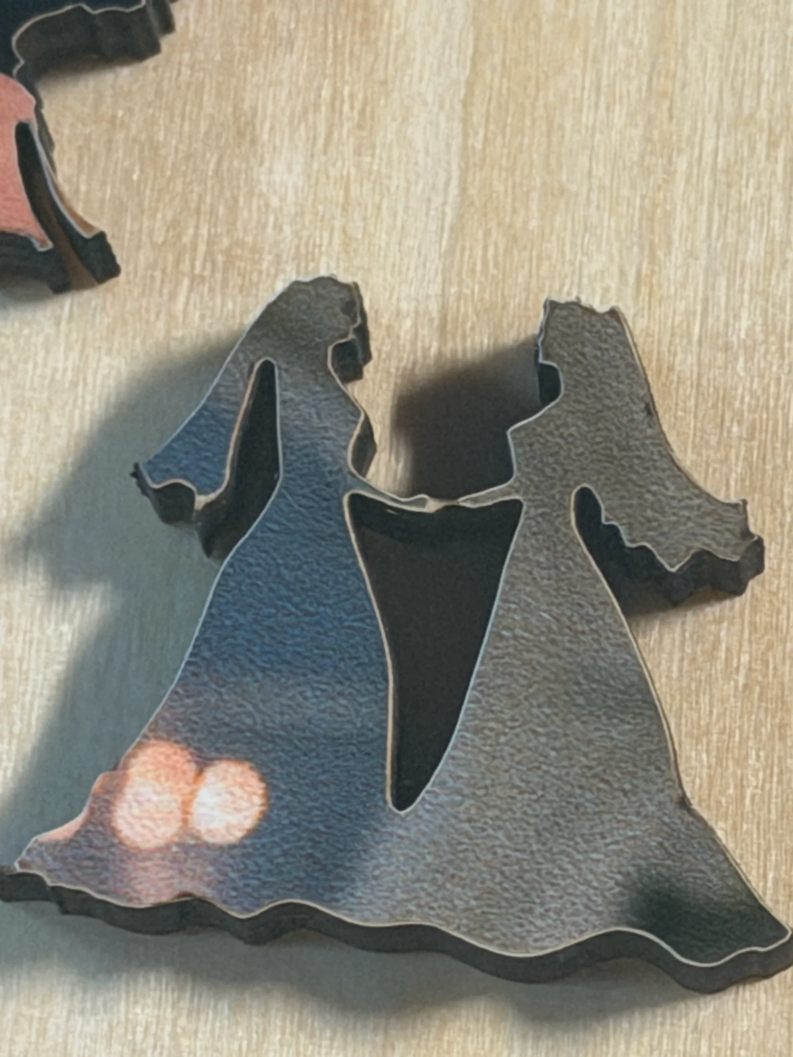 Bride and groom silhouette pieces cut from the couple's wedding photograph