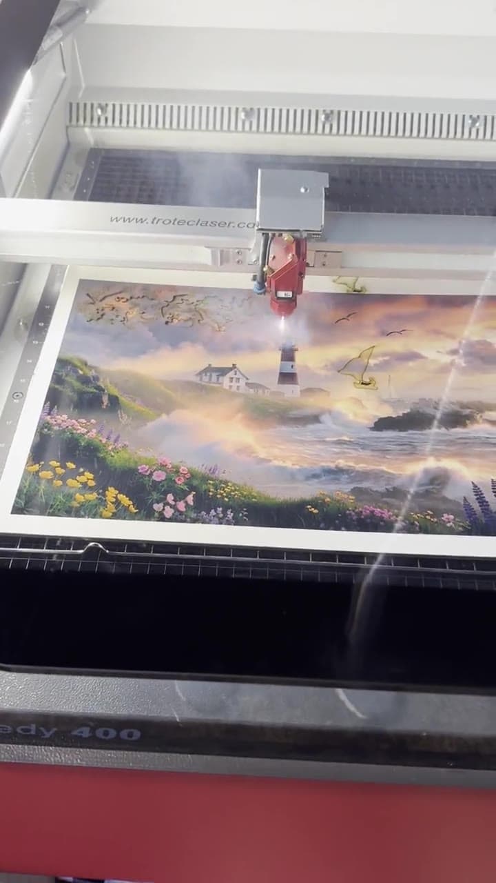 A full-color Whittled puzzle being precision cut in the Flippin workshop